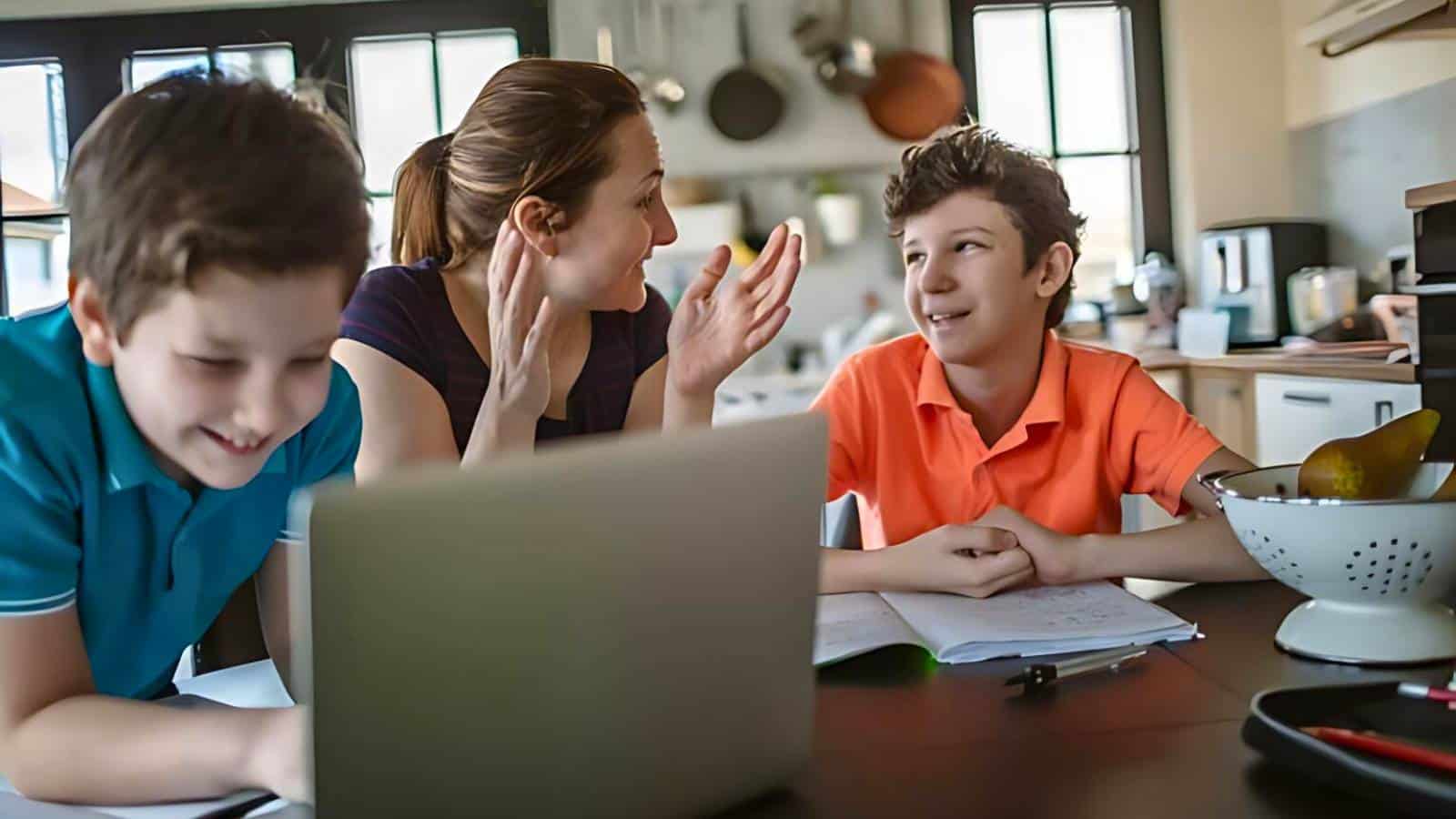 Child standing on rocks in a stream with flowing water and small waterfall in the background, surrounded by rocky and vegetated terrain.