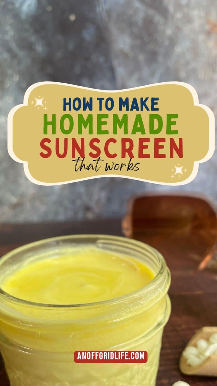 A jar of homemade yellow sunscreen sits on a wooden surface with a sign above that reads, "How to make homemade sunscreen that works.
