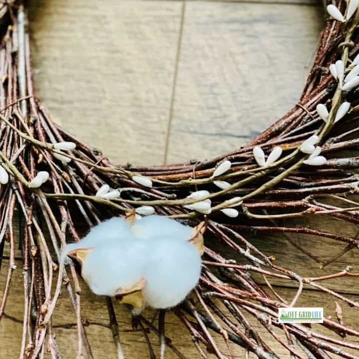 Cotton balls on farmhouse wreath.