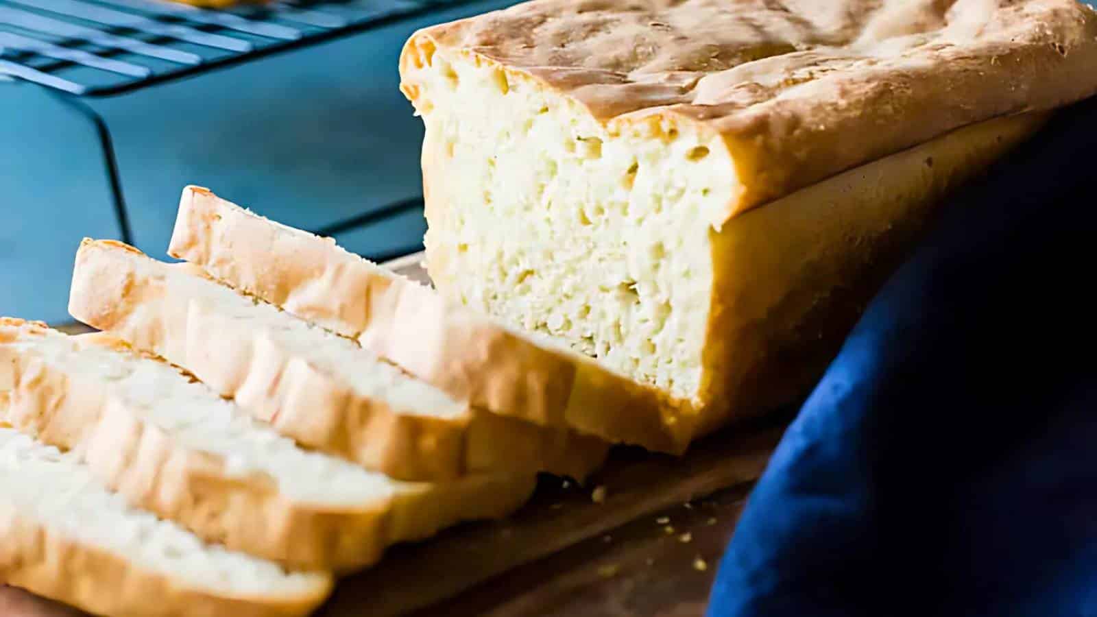 Slices of bread with a golden crust arranged in a basket.