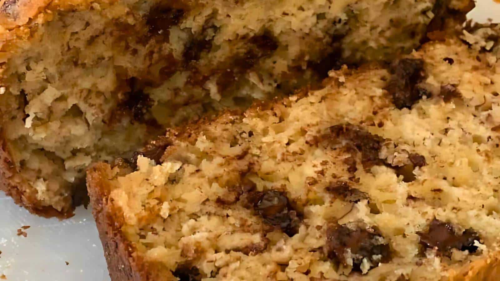 A close-up of sliced banana bread with chocolate chips on a white surface, perfect for hearty fall breakfasts.