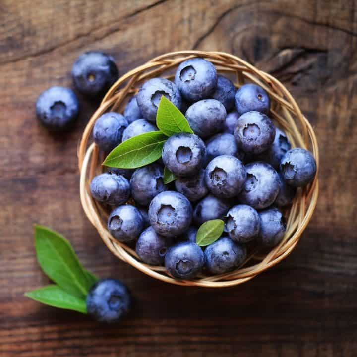 Fresh blueberries in a basket on a table