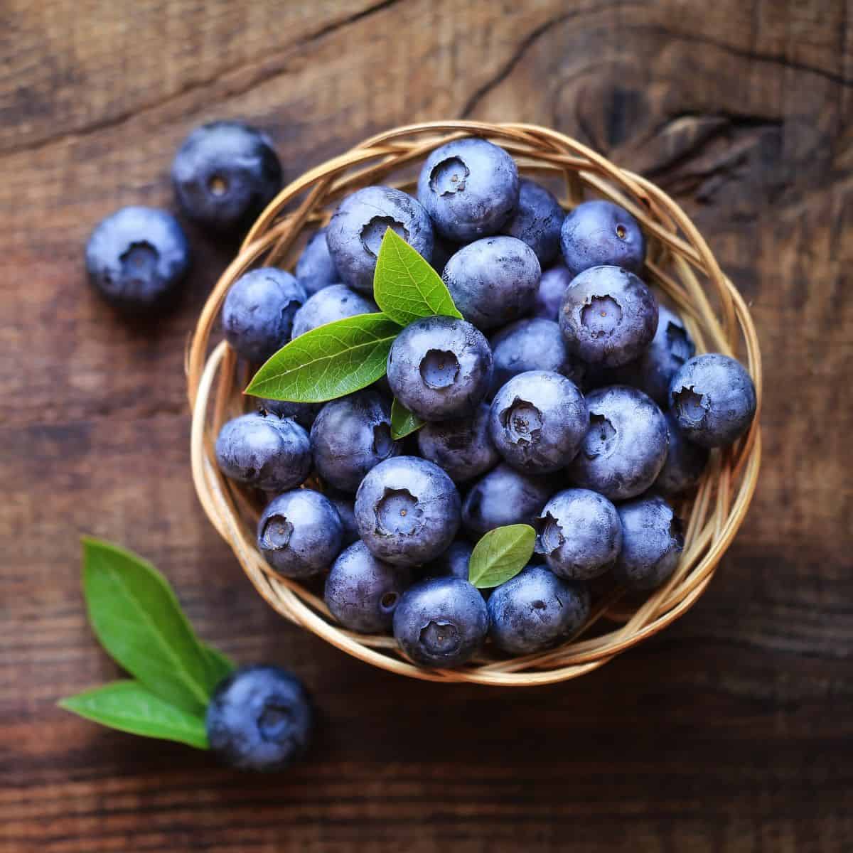 Fresh blueberries in a basket on a table