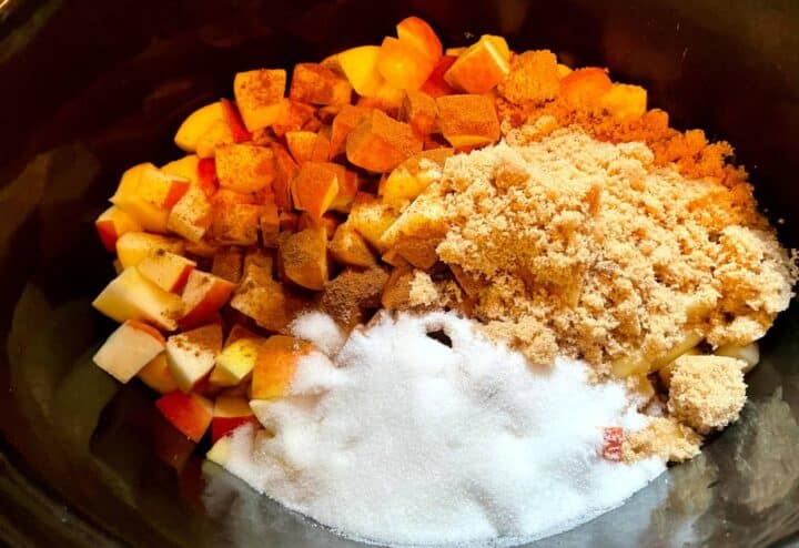 The ingredients for apple crisp in a slow cooker.