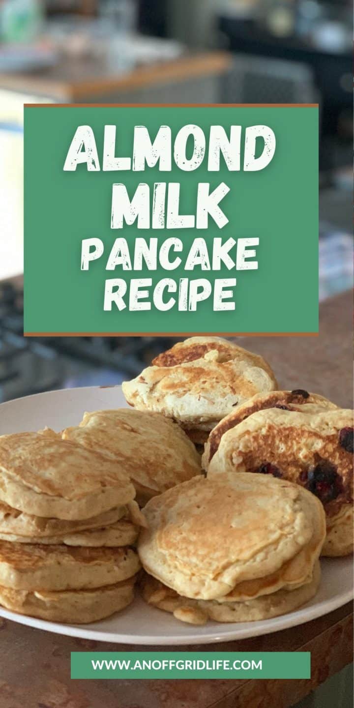 A plate of pancakes with a text overlay saying "Almond Milk Pancake Recipe" and a website URL at the bottom.