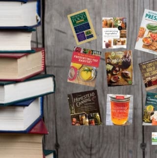 A stack of books on the left and nine best canning and preserving books arranged vertically on the right side against a wooden background.