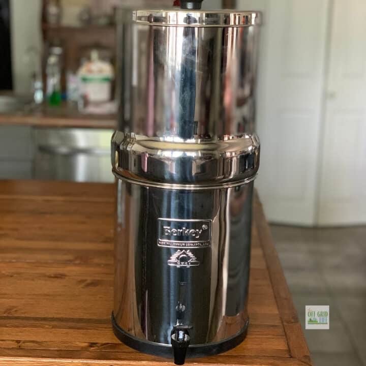 Berkey water filter on wooden island.
