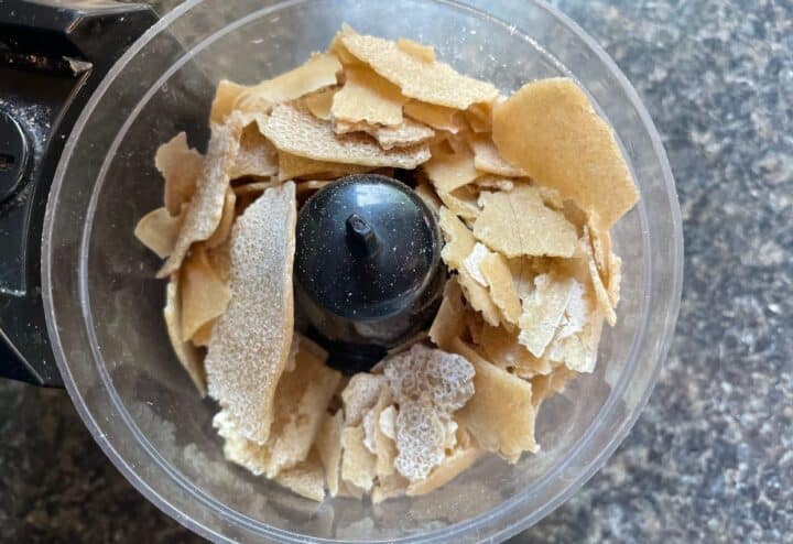 Crushing dehydrated sourdough starter in food processor.