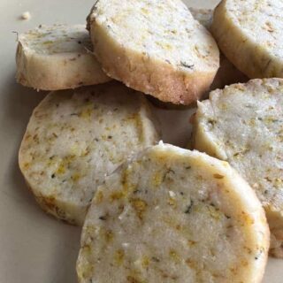 Dandelion almond shortbread cookies on plate.