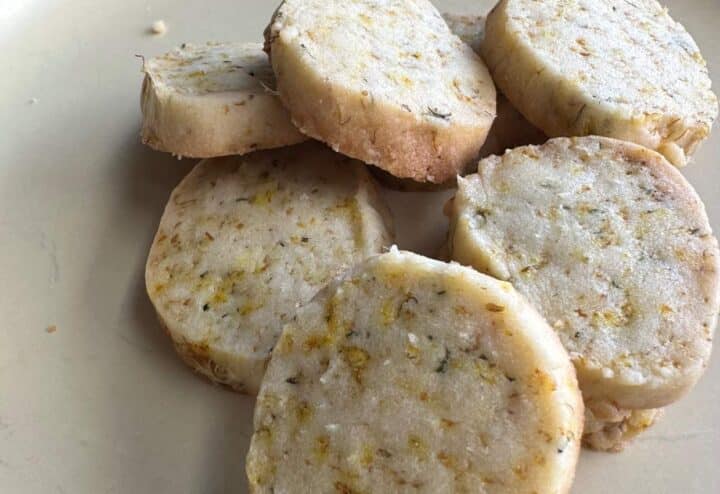 Dandelion almond shortbread cookies on plate.