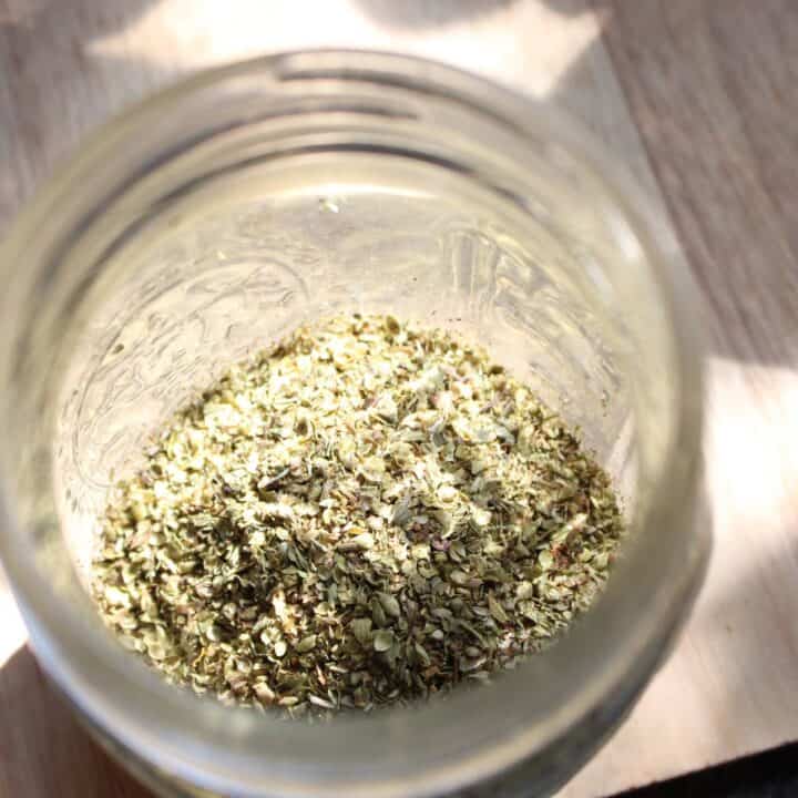Dried oregano flakes in mason jar
