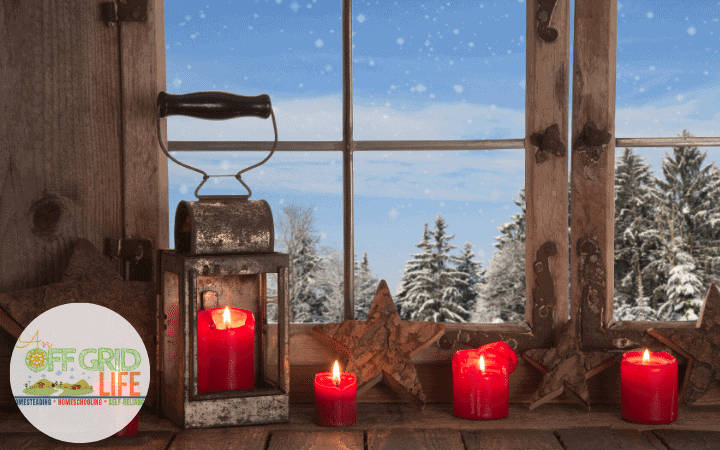 Red candles in a cabin window