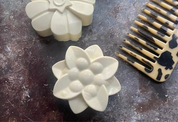 A comb and a comb with a flower on it.