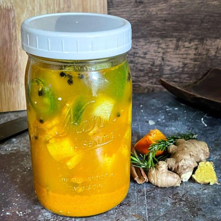 Fire cider original recipe with fresh herbs.