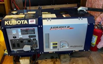 a picture of a blue Kubota generator in a generator shed
