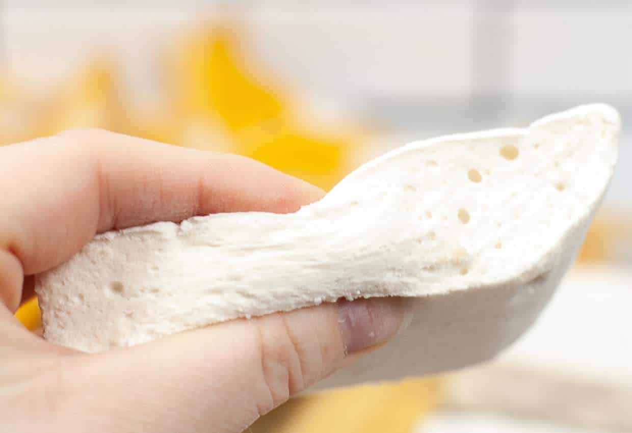 Squeezing homemade marshmallows.