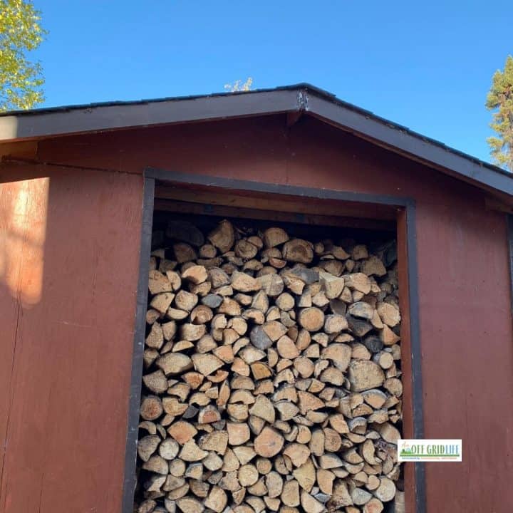 The wood shed at our off grid home full of chopped and stacked firewood - about 5 cords