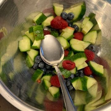 Making cucumber berry fruit salsa.