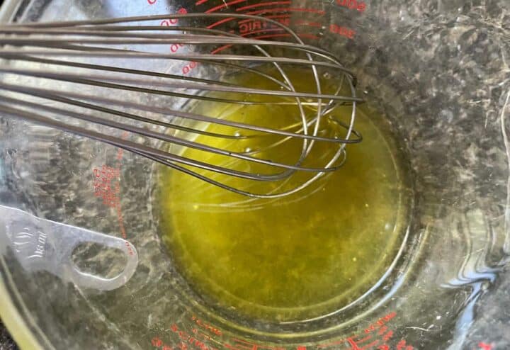 Mixing melted beeswax and oil.