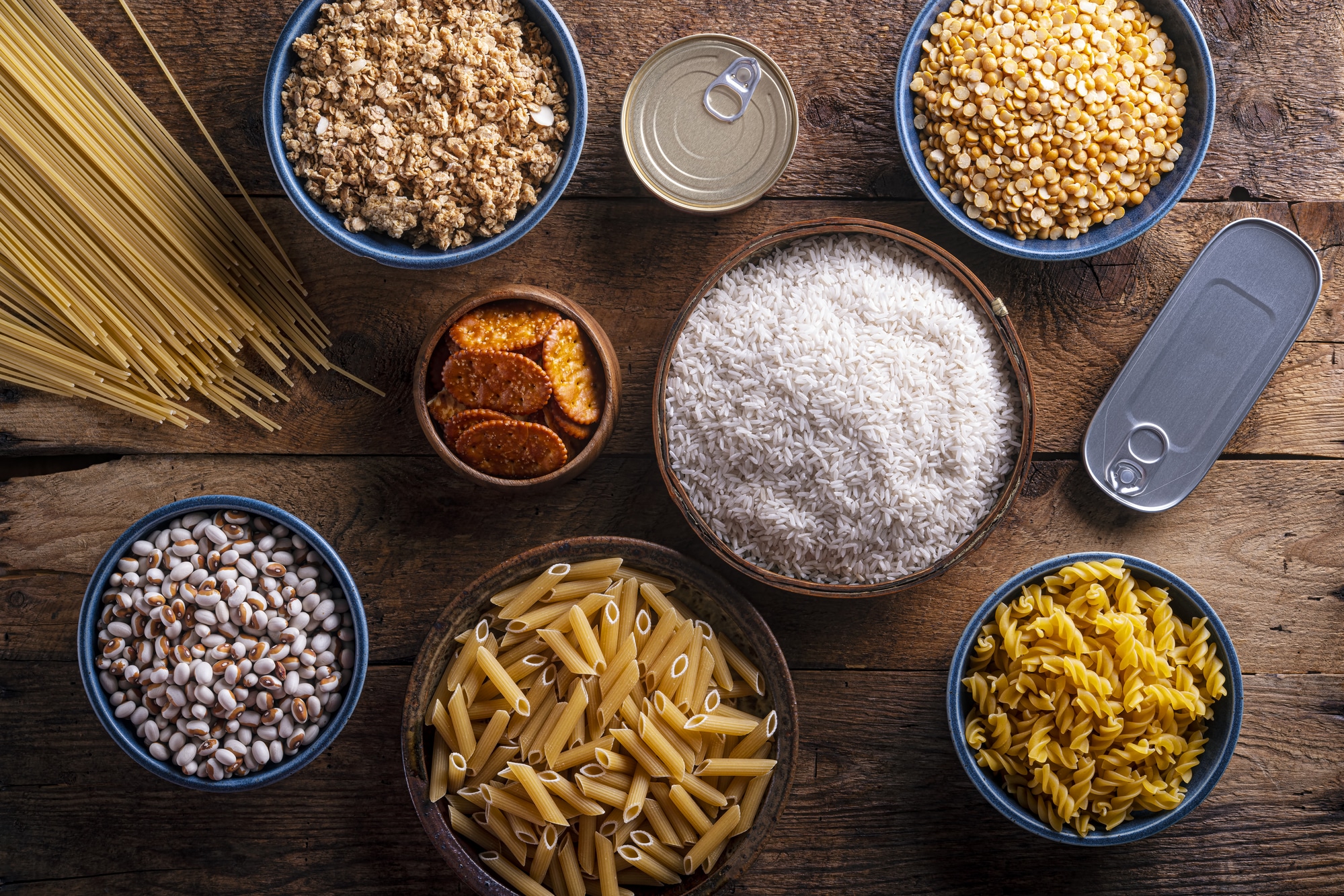 Various types of food on a wooden table.