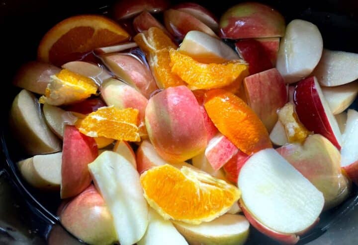 A bowl of fruit in water.