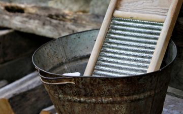 a picture of a washboard in a steel basin outdoors