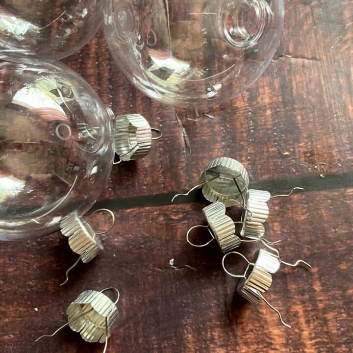 A bunch of glass ornaments on a wooden table.