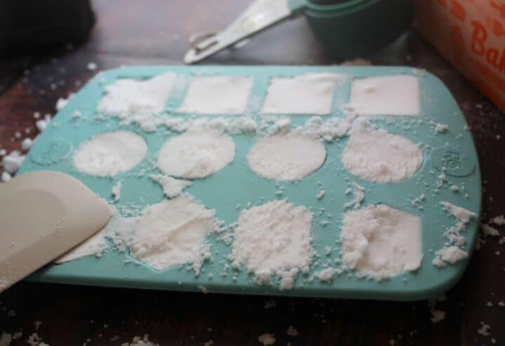 Pat toilet bomb mixture into silicone molds