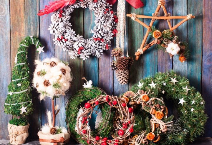 A collection of christmas decorations on a wooden background.