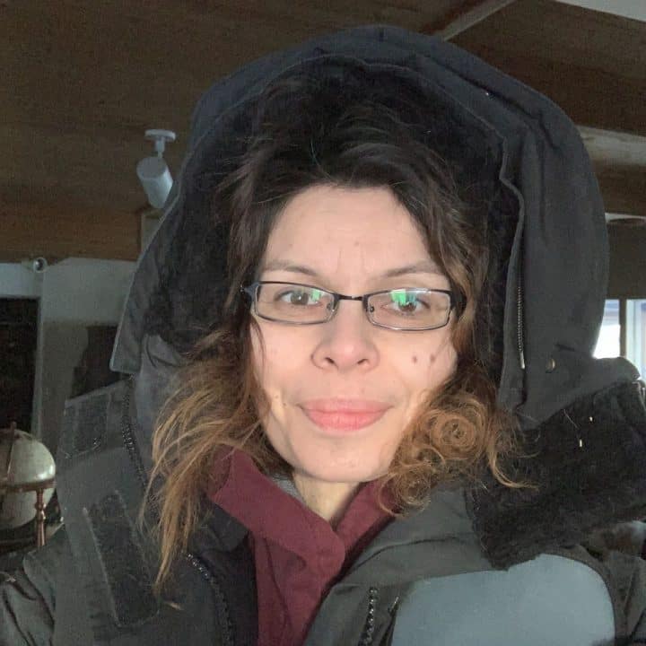 Sarita Harbour of An off Grid Life wearing glasses and a hoodie taking a selfie.