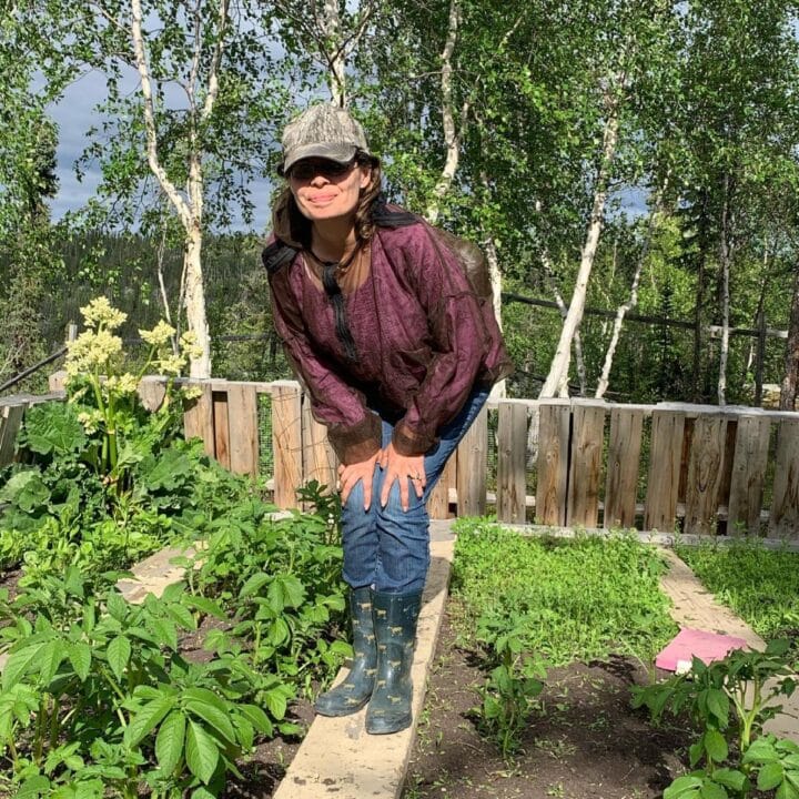 Sarita Harbour in her off grid homestead garden.