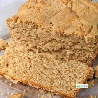 Simple Peanut Butter Bread sliced on a cutting board