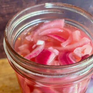 Sliced pickled red onions in jar -close up