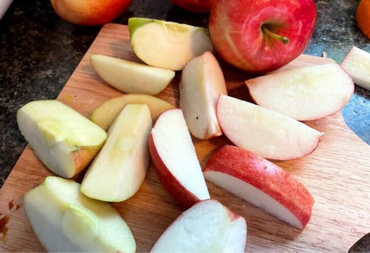 Sliced apples on a cutting board.