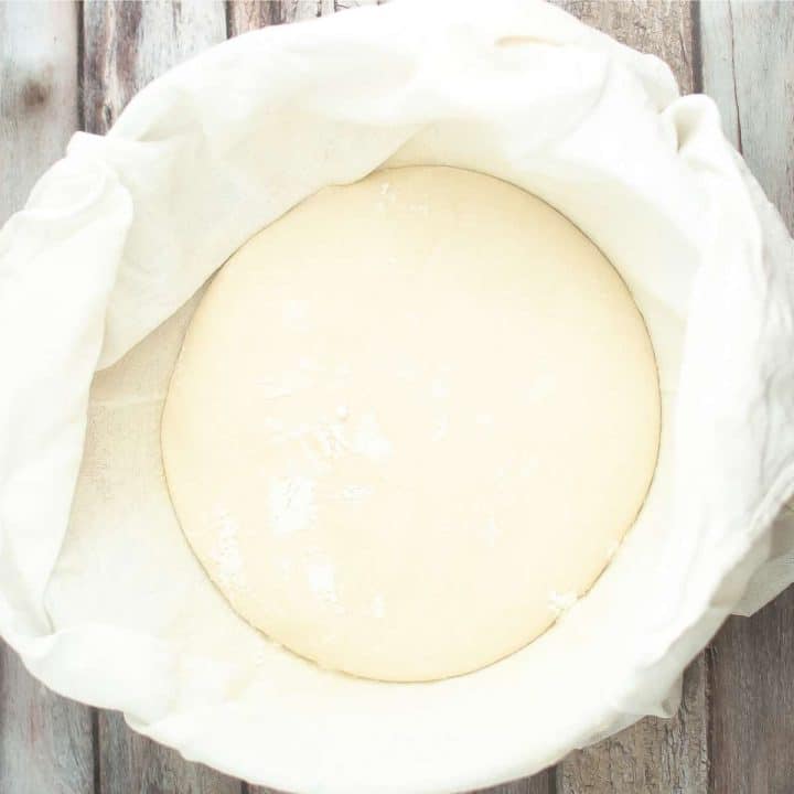 Sourdough in a bowl on a wooden table.