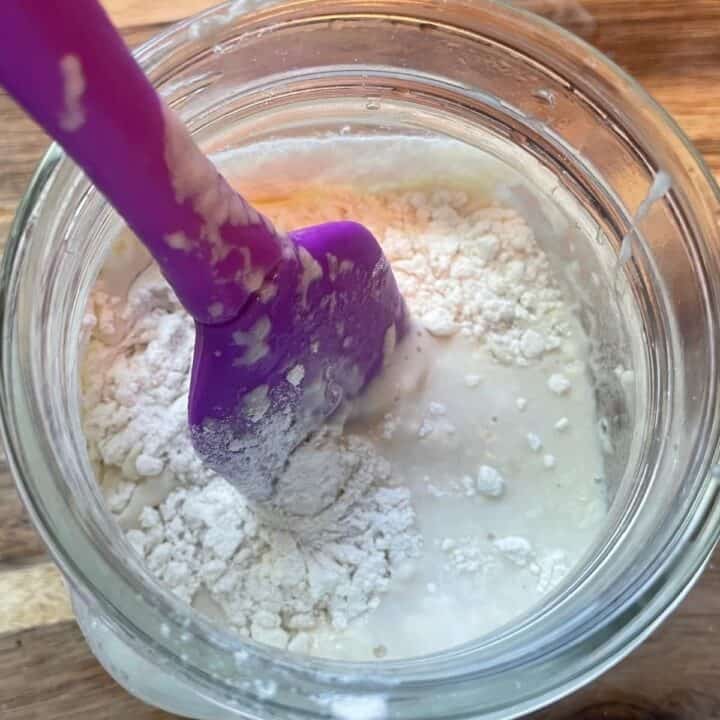 Mixing more flour into my homemade sourdough starter recipe