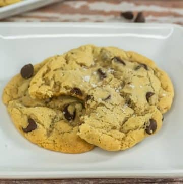 A plate of sourdough chocolate chip cookies on a white plate.