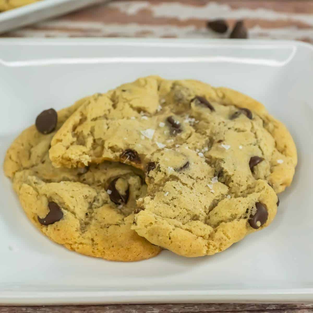 A plate of sourdough chocolate chip cookies on a white plate.