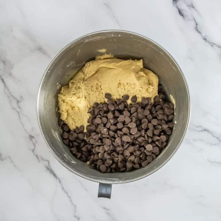 Chocolate chip cookie dough in a mixing bowl.