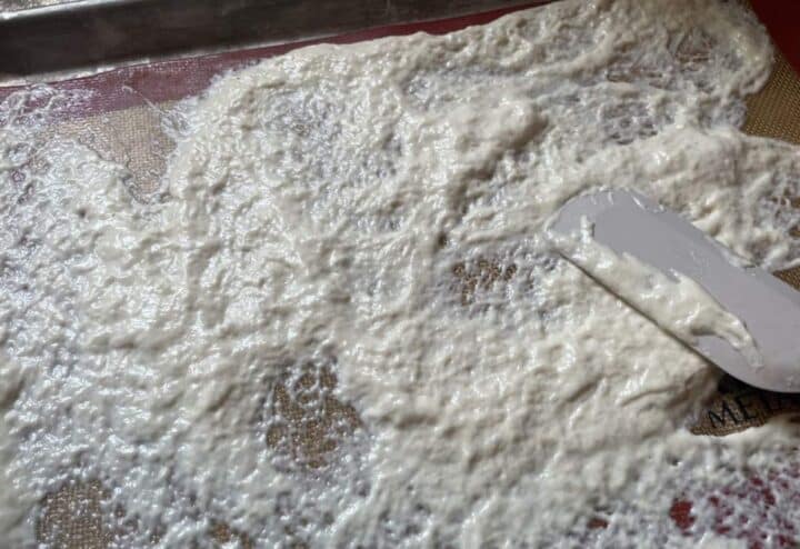 Spreading the sourdough starter.