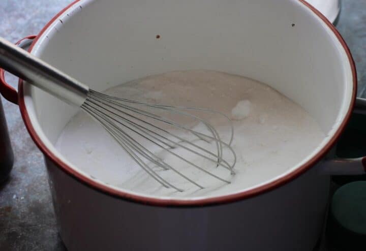 Stirring laundry detergent.