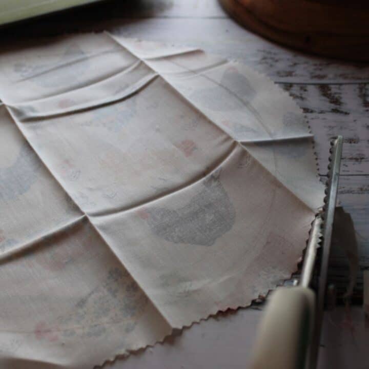 Using pinking sheers to cut fabric for beeswax wraps