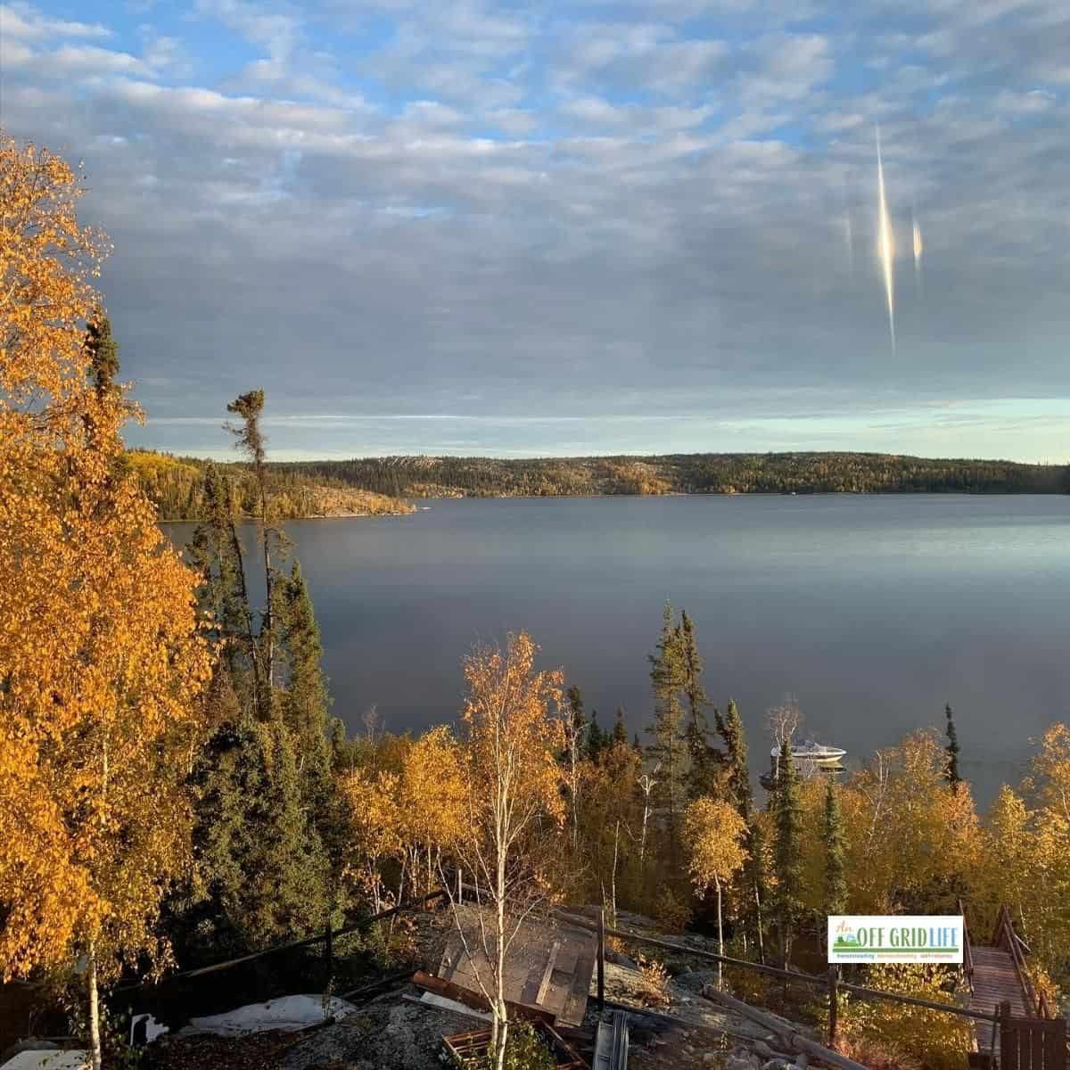 Autumn View of trees changing color and lake in background - why we live off the grid in the subarctic