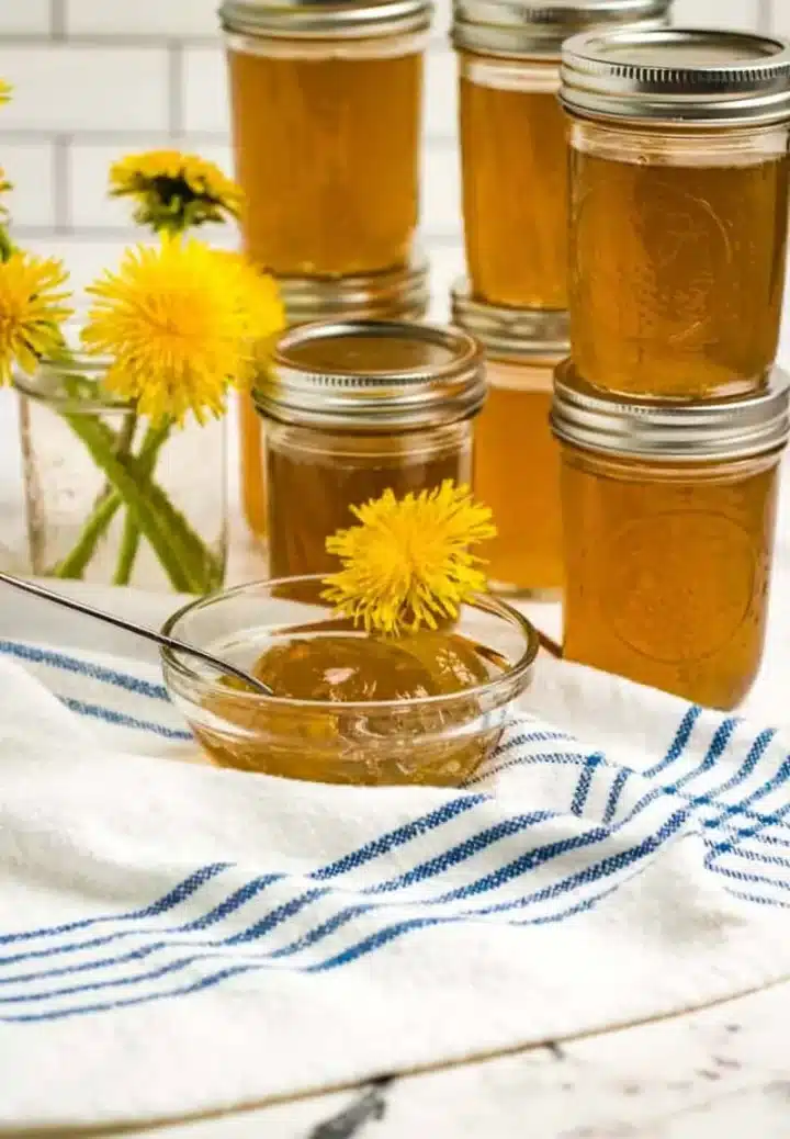 bowl and jars of dandelion jelly