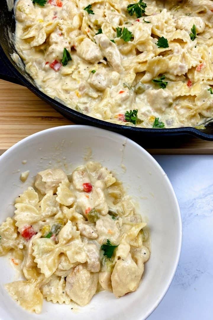 Chicken and pasta cooked in a dutch oven skillet.