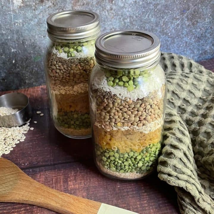 Two mason jars filled with rice and peas.