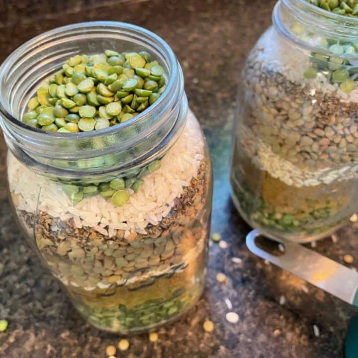 Two mason jars filled with peas and rice.