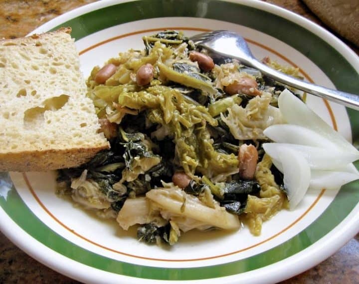 greens and beans on plate with toast and onions