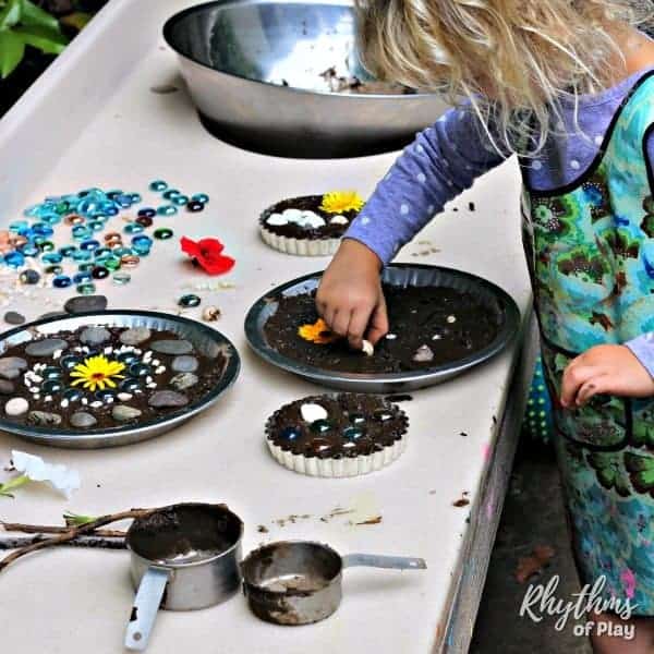 girl making mud pies