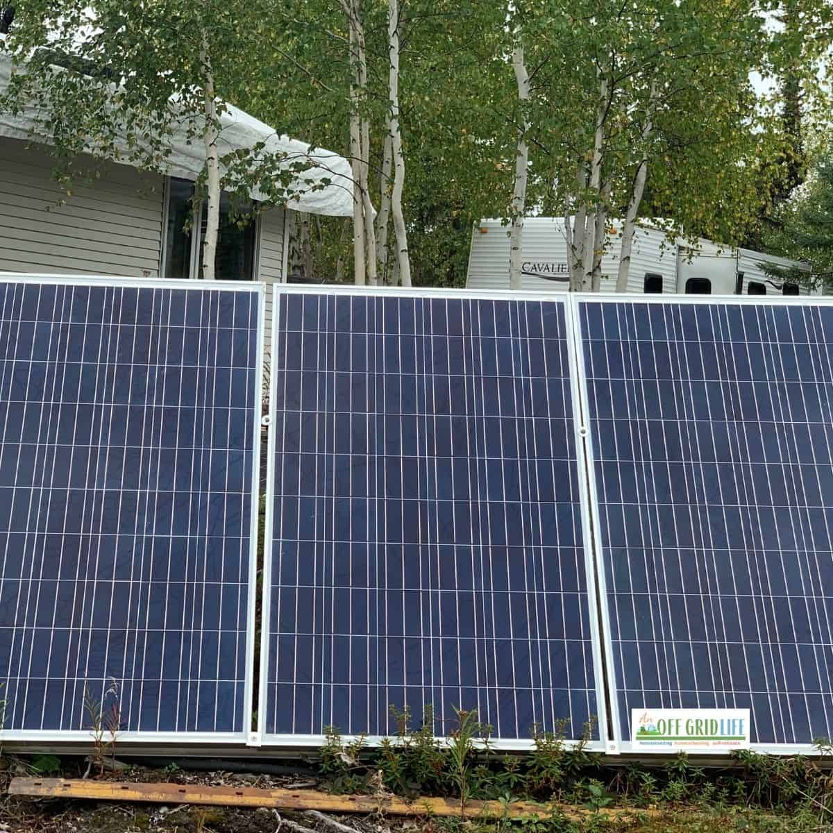 Solar panels on a frame at ground level generating Off grid electricity